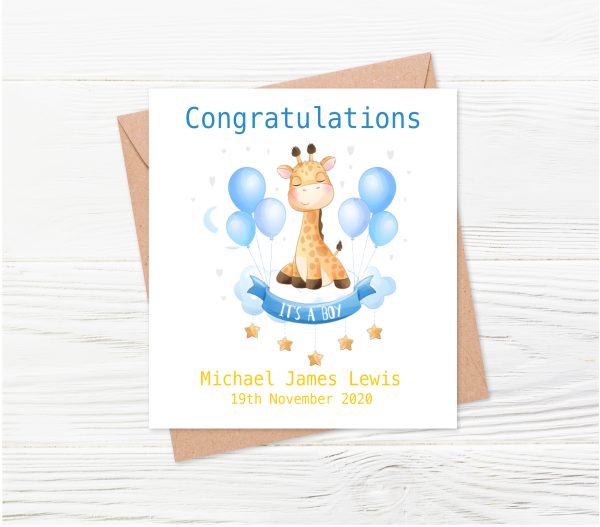 baby giraffe with blue balloons on white wooden background.