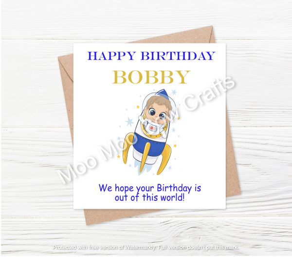 rocket with spaceman on white card