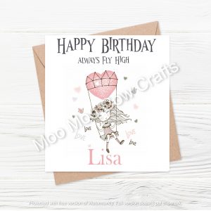 girl on swing with balloon heart