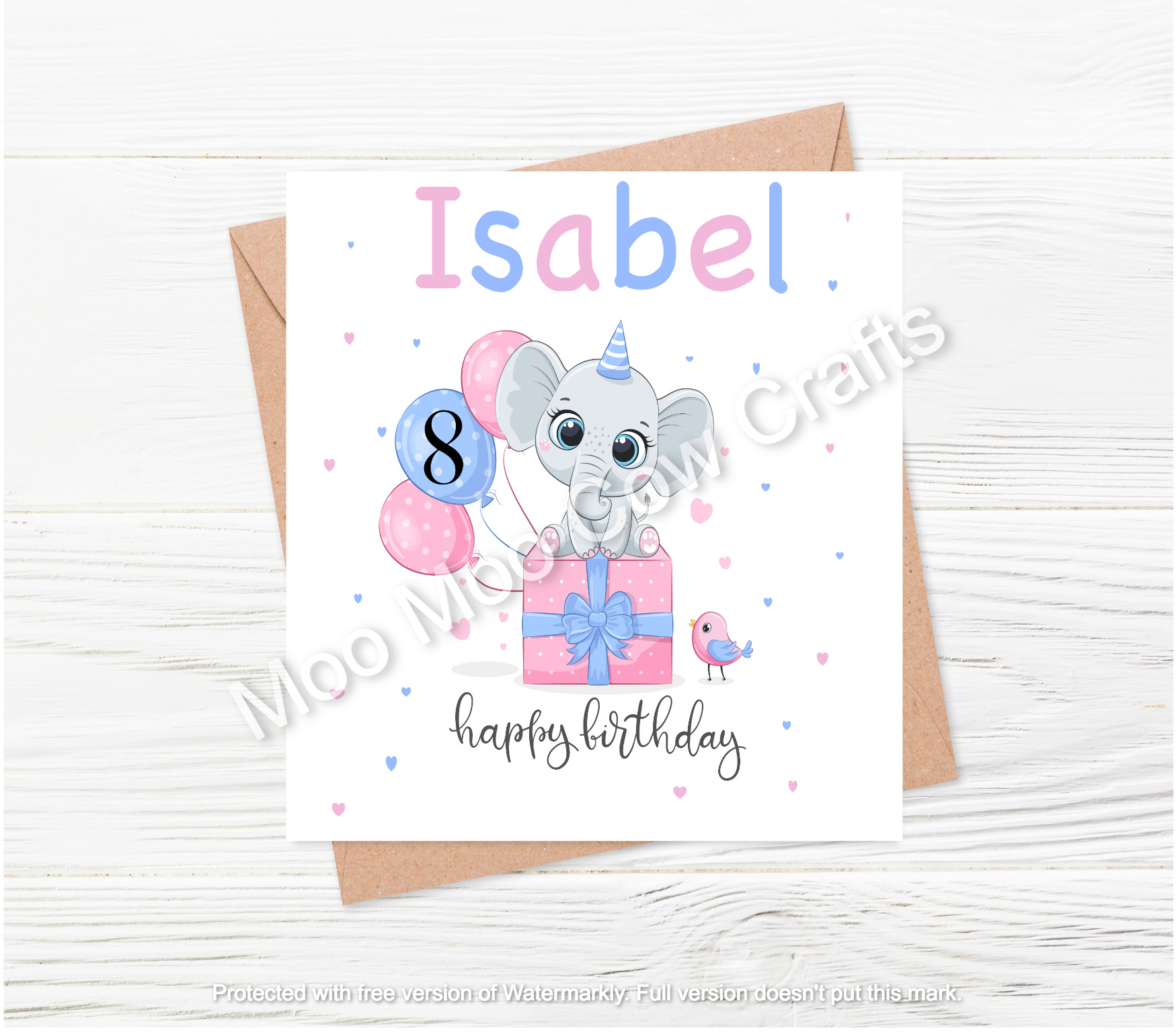 elephant on box with balloons on white wooden background