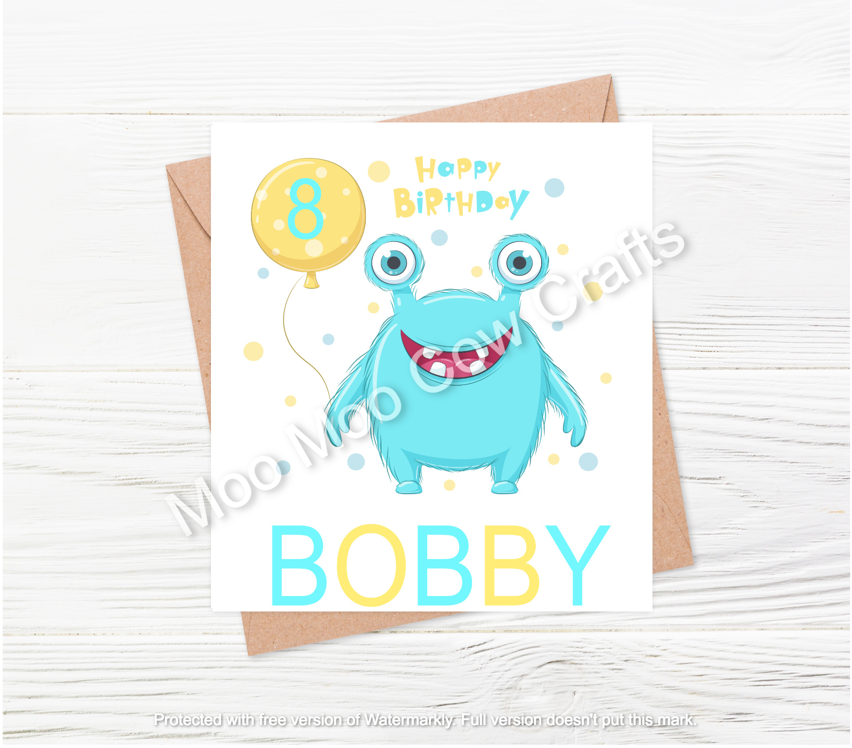 monster with ballon on envelope and white wooden background