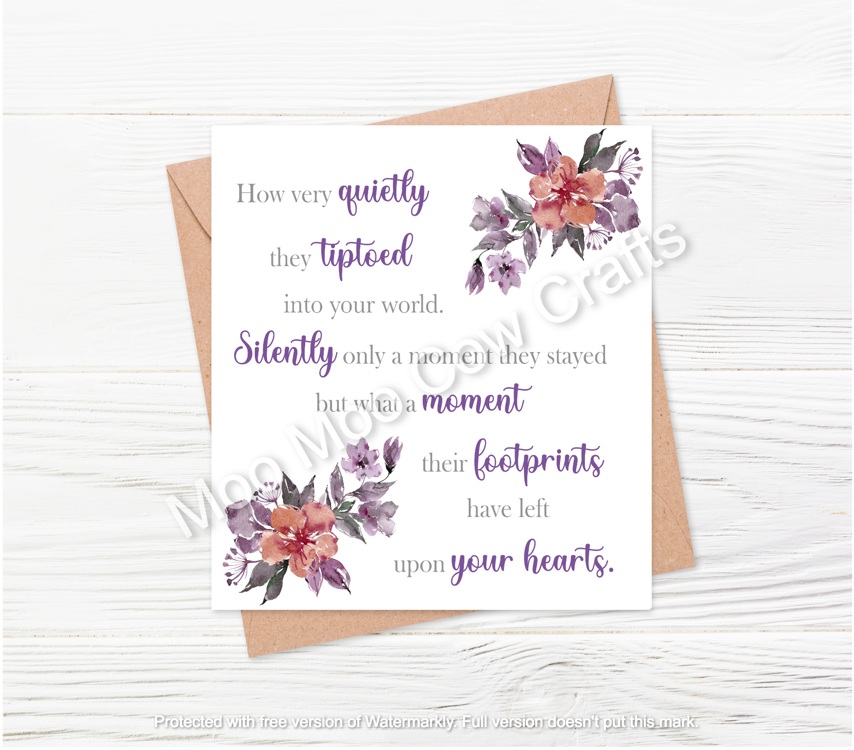 text with purple flowers on white backhground with brown envelope on white wooden background