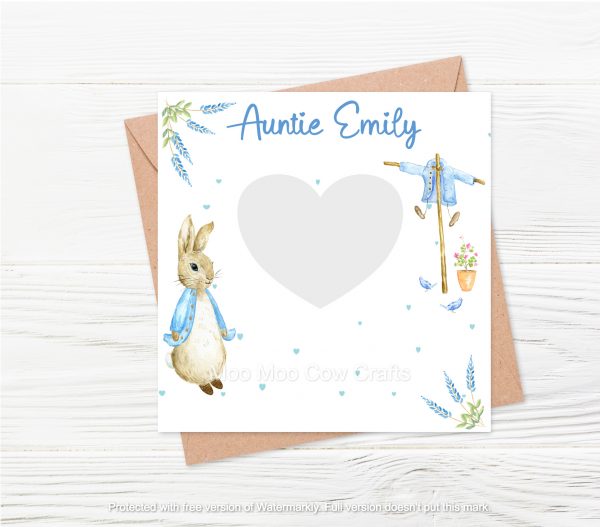 rabbit on white square withn text and brown envelope and wooden background