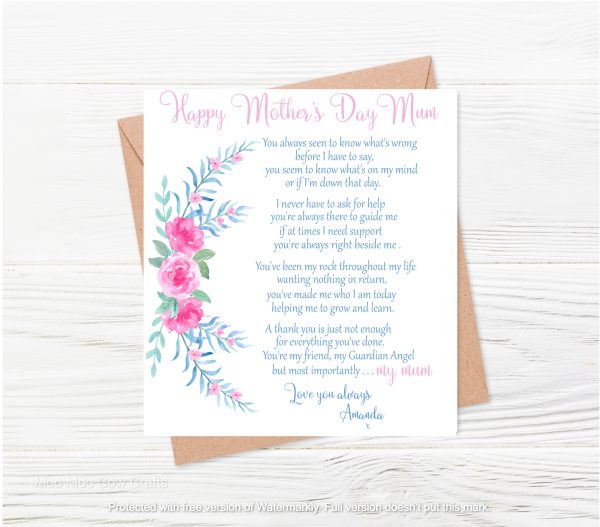 text with pink flowers and brown envelope on wooden background