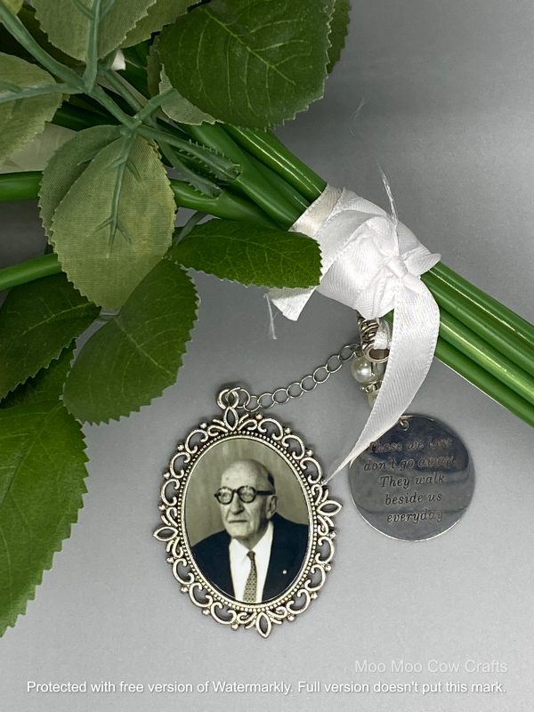 pendant with an old man's picture on a bouquet