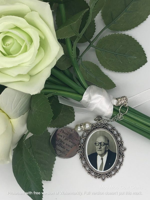 pendant with a old man picture on a bouquet of flowers