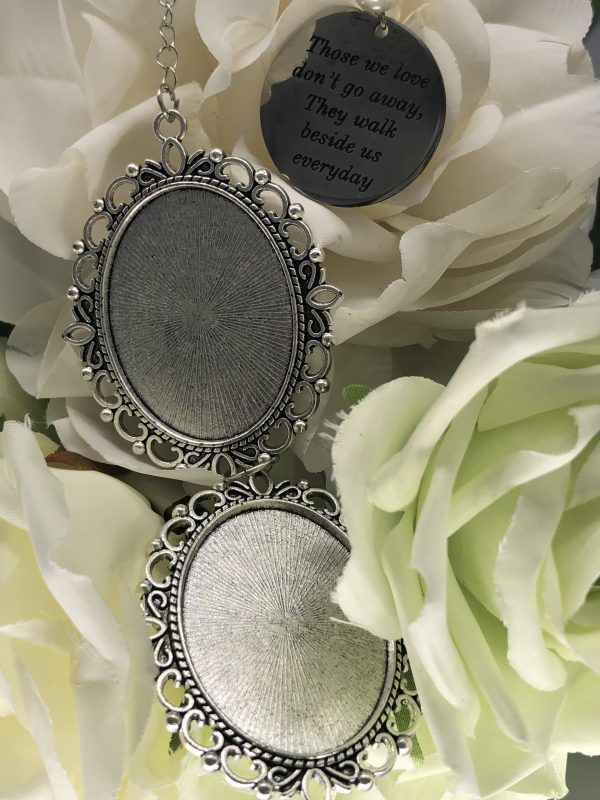 two blank pendants on white rose