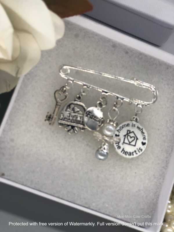 5 silver charms on kilt pin