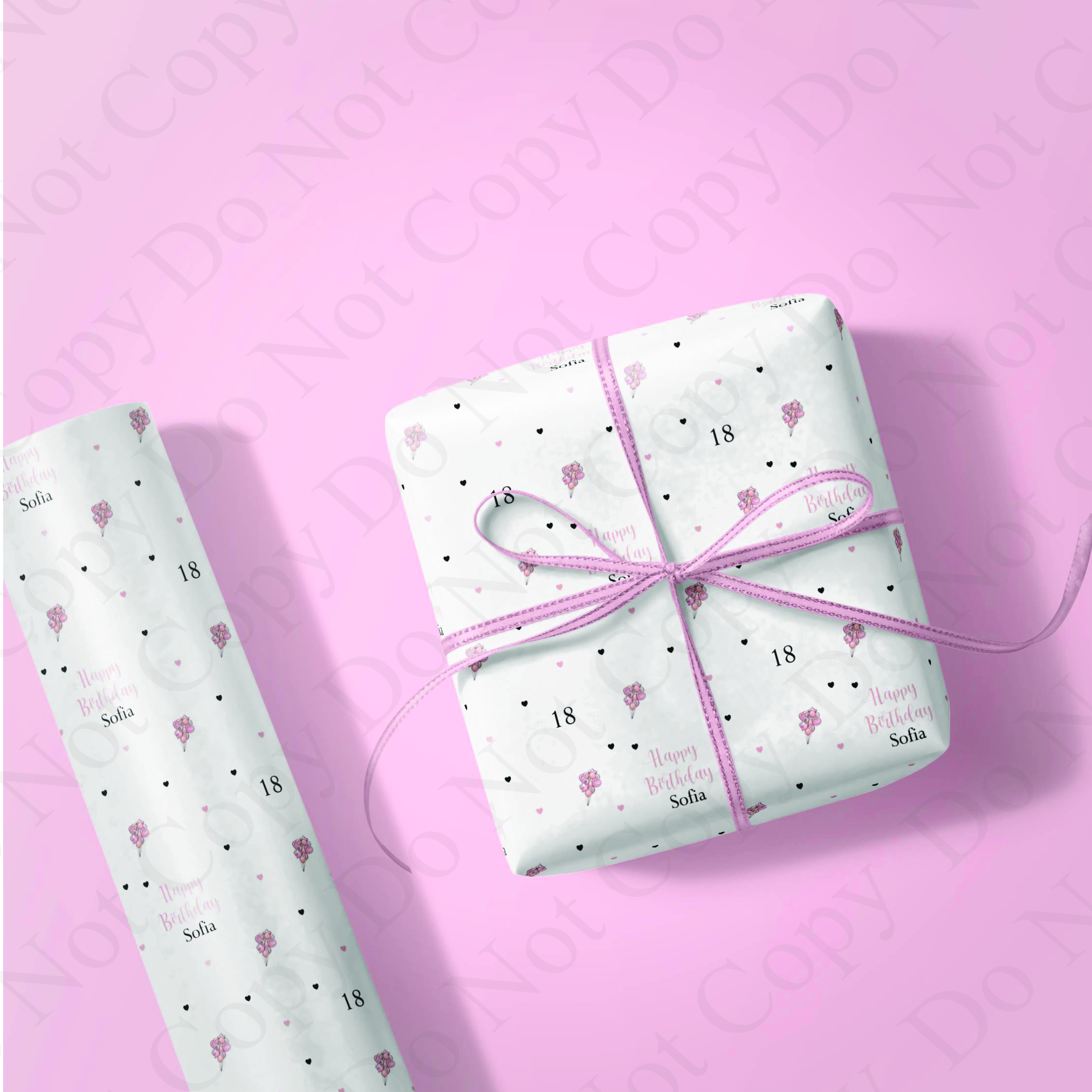 pink background with a gift box wrapped in pink balloon design paper.