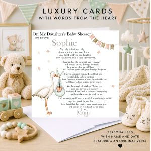 nursery background with a white card standing on an envelope - clip art image of a mocha stork and a baby mobile hanging from a cloud - black text - it's a card for a baby shower.