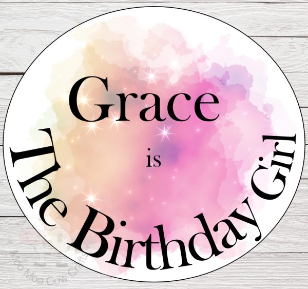 birthday badge on wooden background