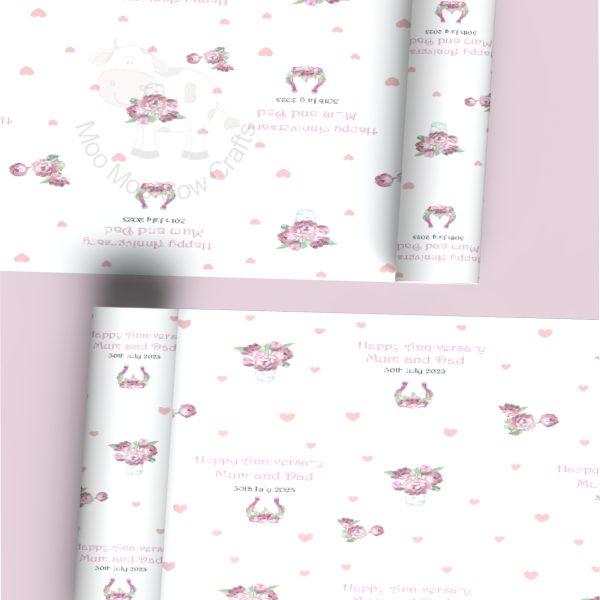 two rolls of wrapping paper with pink flowers