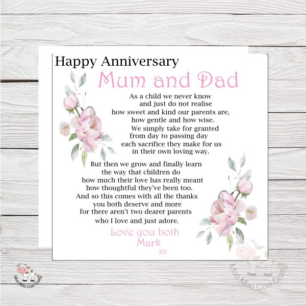 wooden background with white card with pink peonies