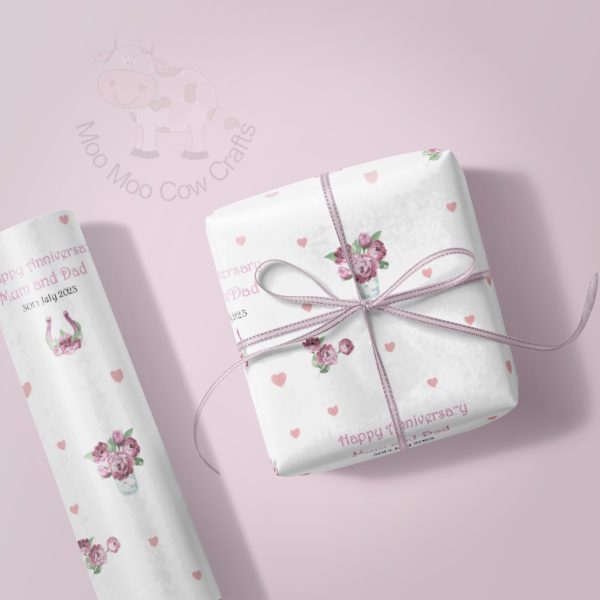 lilac background with wrapping paper rol and gift box
