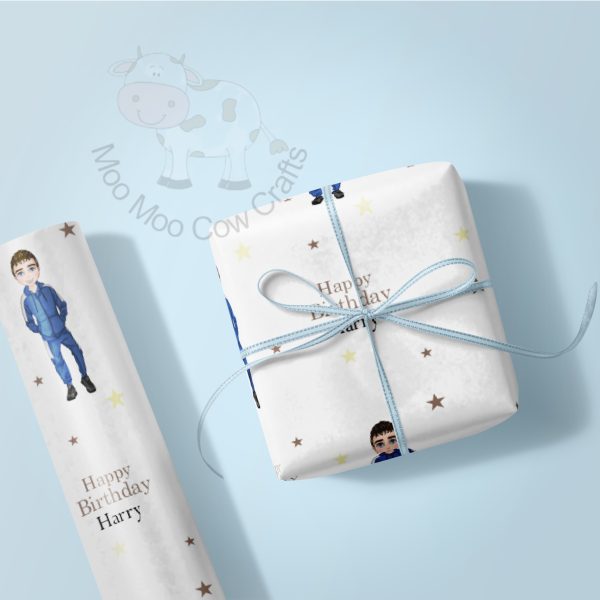 gift box and roll of wrapping paper with young boy in blue tracksuit
