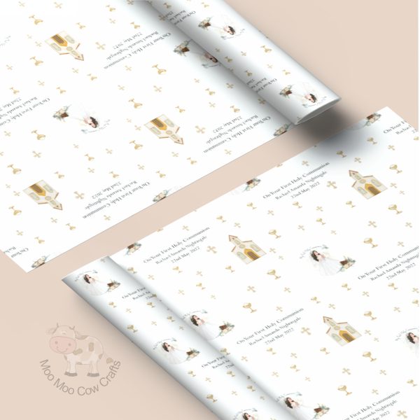 two rolls of wrapping paper with first holy communion design