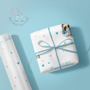 gift box and wrapping paper roll on blue background