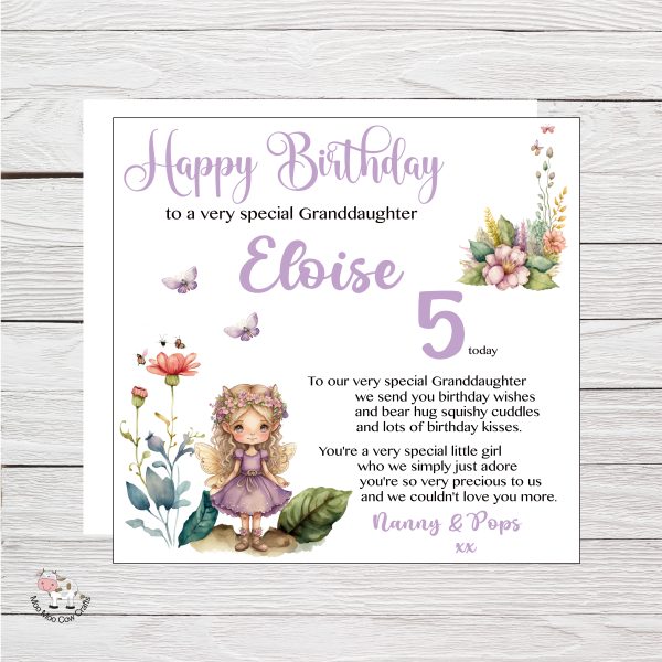 fairy birthday card on wooden background