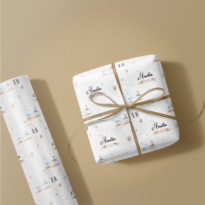 beige background with image of roll of wrapping paper and a gift box wrapped