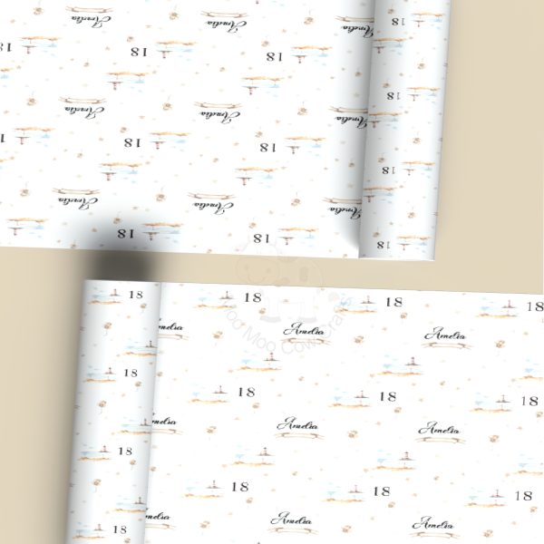 beige background with two rolls of wrapping paper with clipart images of a lighthouse