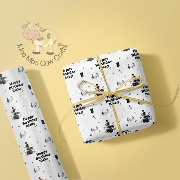 lemon background with image of gift box wrapped and wrapping paper.