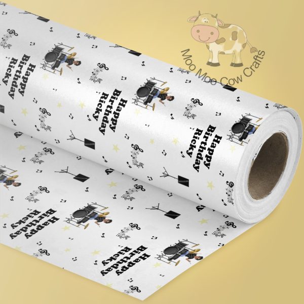 lemon background with single roll of wrapping paper with a drummer repeating pattern.