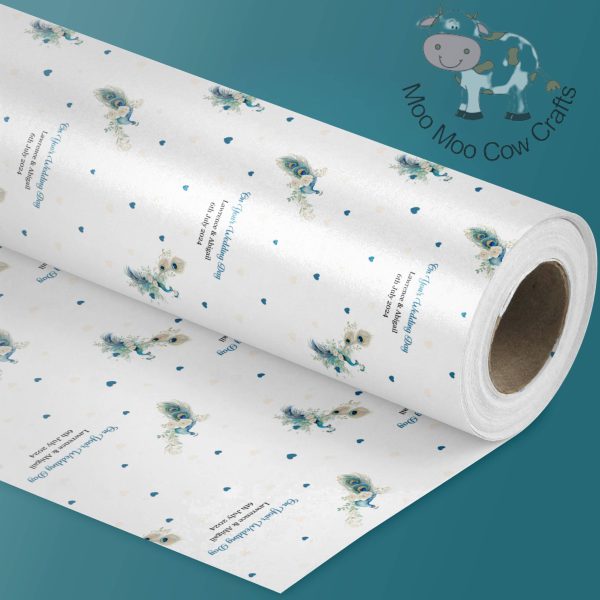 blue background and a roll of wrapping paper with a peacock design