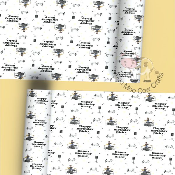 lemon background with 2 rolls of gift wrap with clip art image of a drummer and music notes.