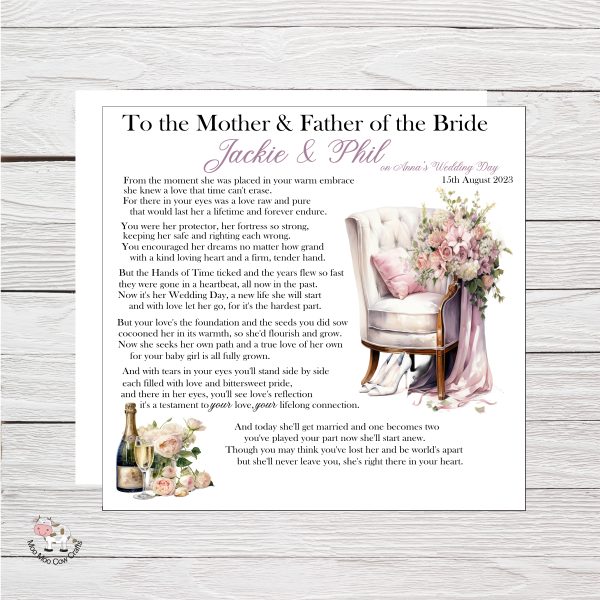 wooden background with white card with image of chair, flowers and white shoes and a bottle of champagne and glasses, its a wedding card.