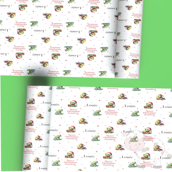 green background with two rolls of gift wrap with a dinosaur design, it's Xmas wrapping paper
