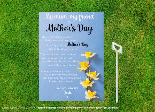 grass with blue card with image of a daffodil and text it's a memorial graveside card