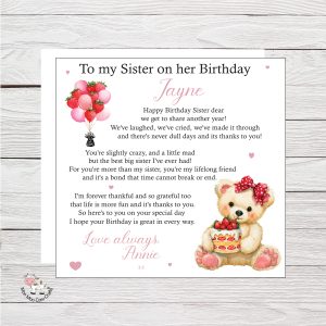 wooden background with clip art image of a teddy bear holding a cake and birthday balloons, black text - it's a birthday card