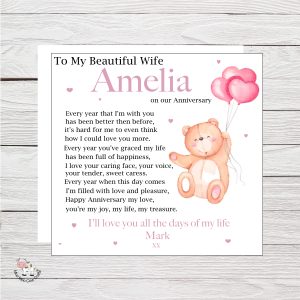 wooden background with clip art image of a teddy holding onto balloons