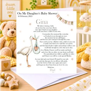 nursery background - white card standing on an envelope - clip art images of a stork - black text - it's a baby shower card from Moo Moo Cow Crafts